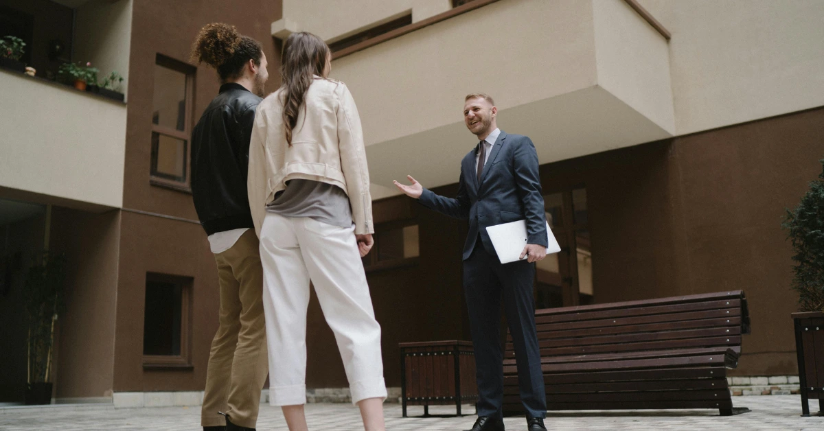 A Couple Talking to a Real Estate Agent