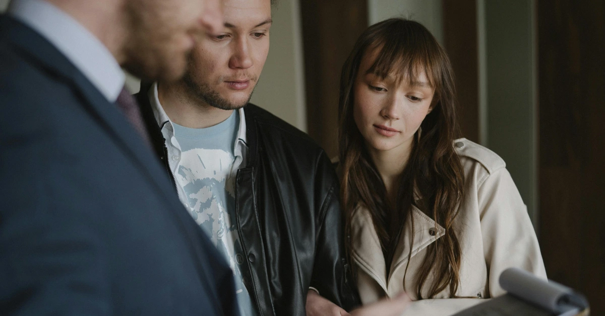 A Real Estate Agent Talking to a Young Couple