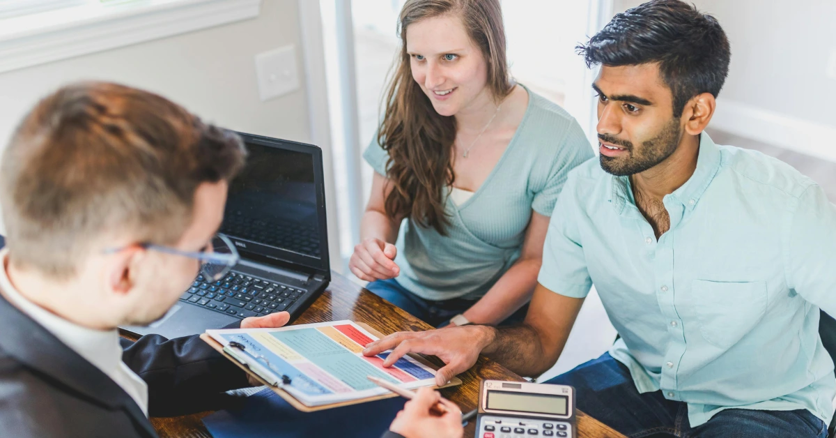 Couple Talking to Real Estate Agent