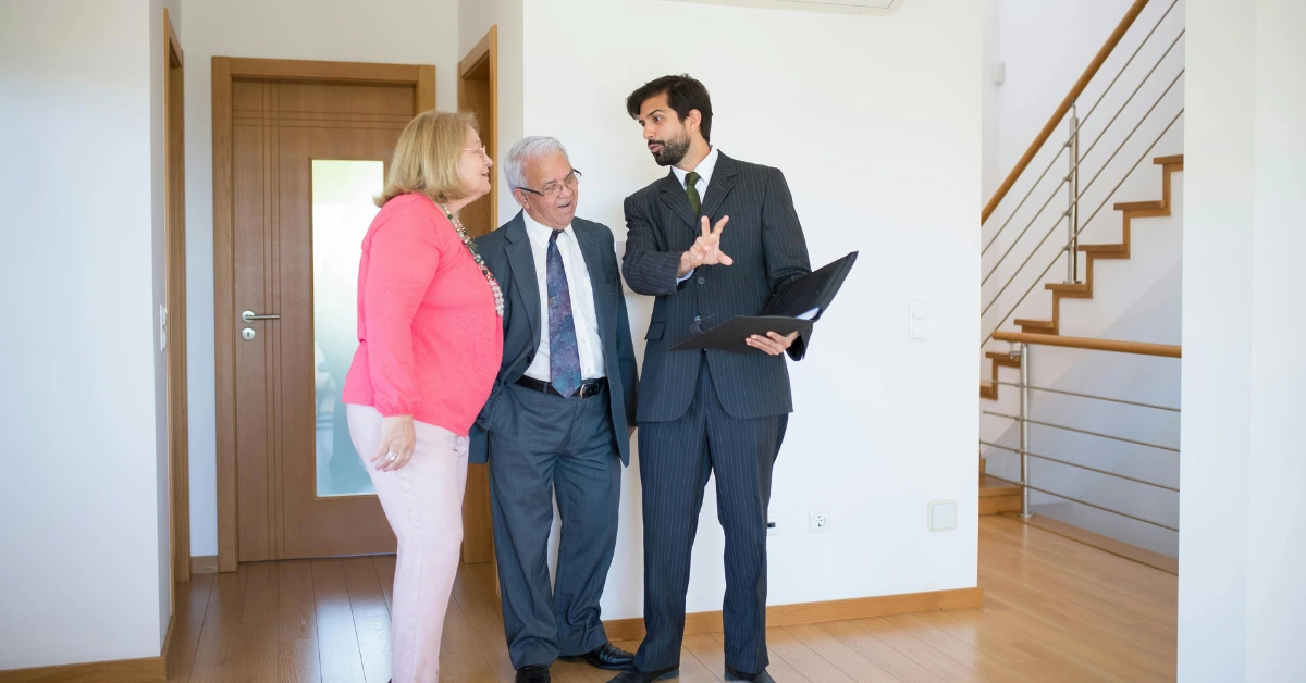 Couple talking to a Real Estate Agent